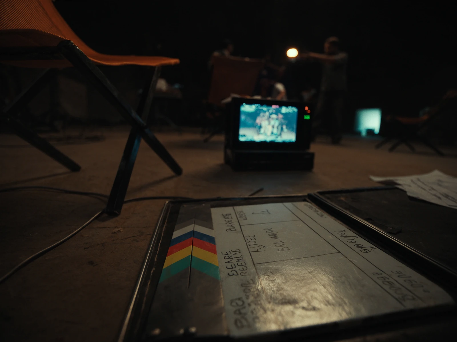 Director’s monitor and clapperboard on an AI film set